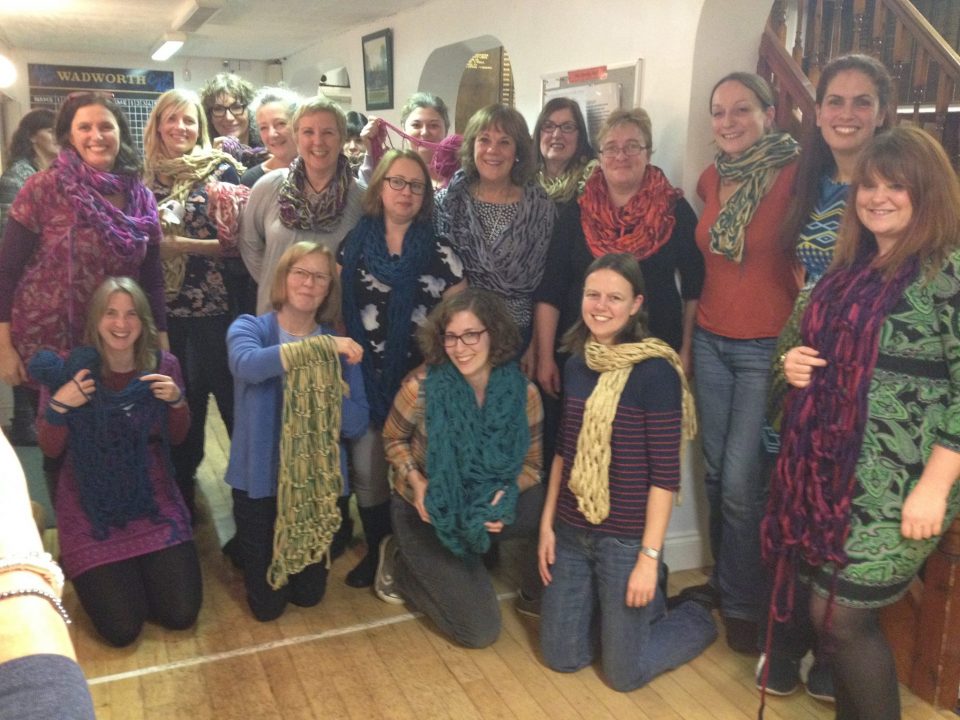 showing our arm knitted scarfs.